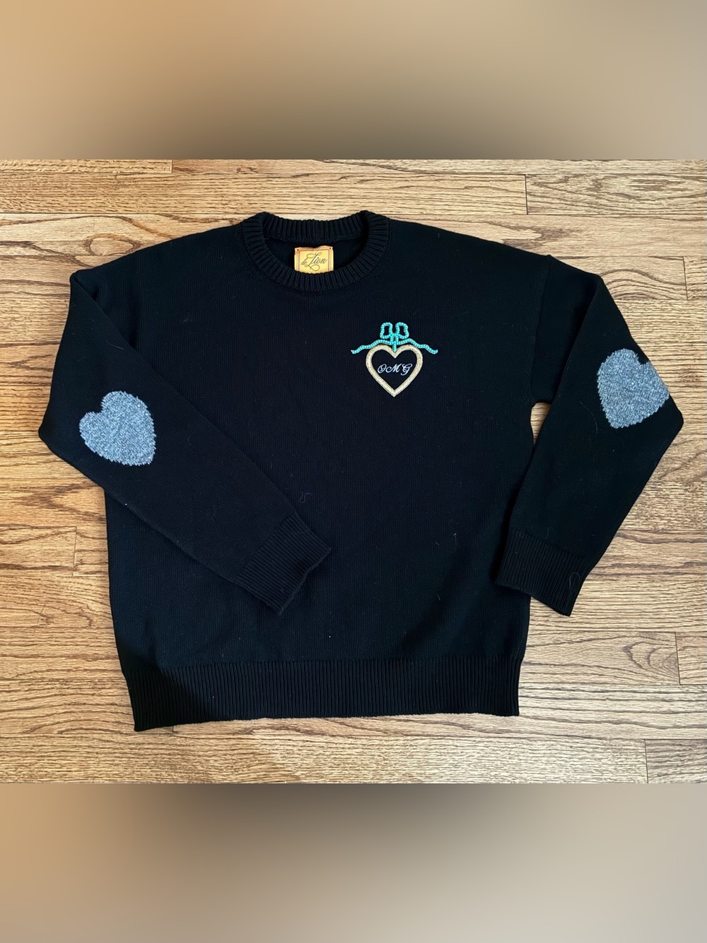 Le Lion OMG Black Crewneck Sweater with Turquoise Bow & Cream Heart